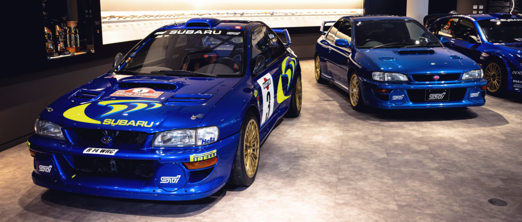 Two Subaru motorsports cars