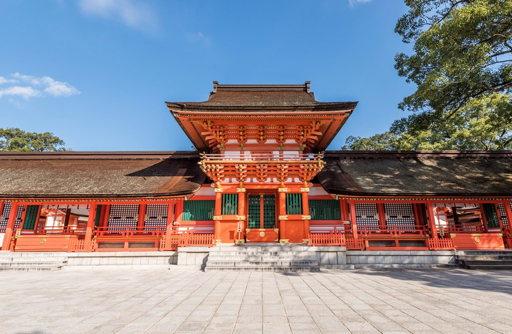 a historic red building standing under the blue sky