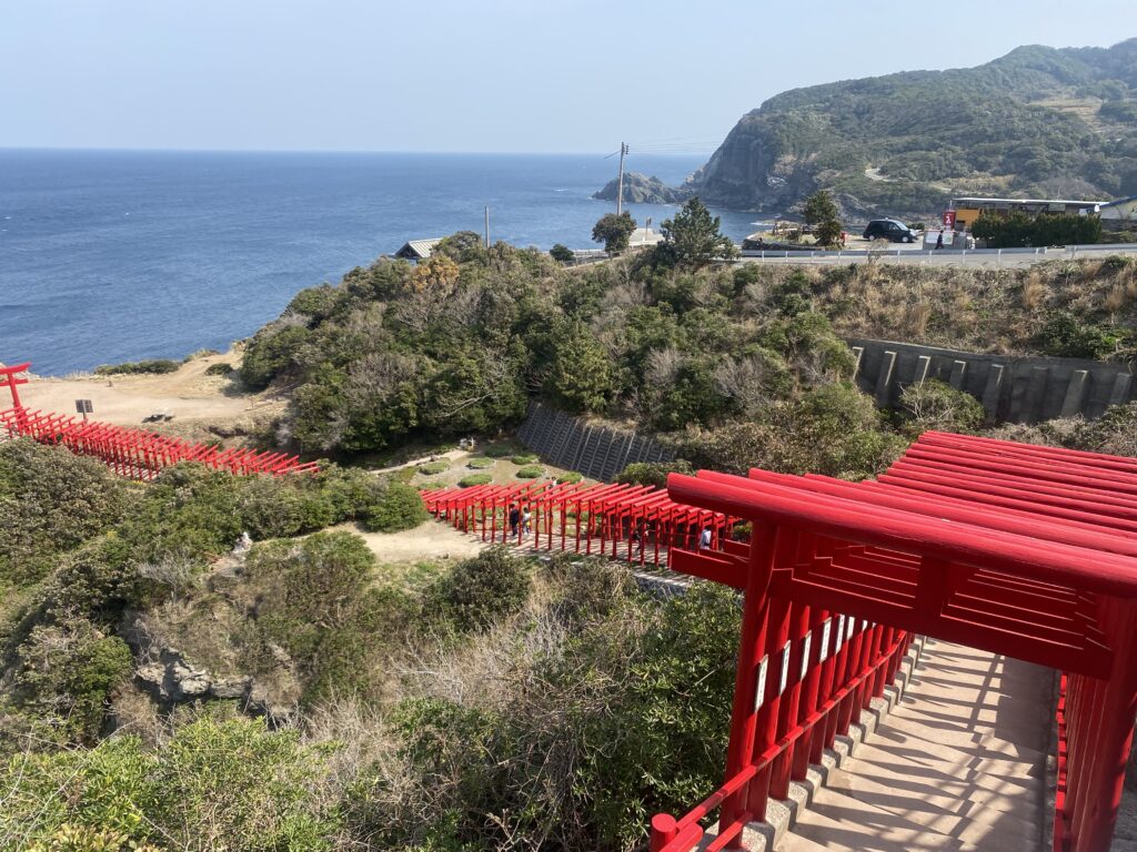 Motonosumi Inari Shrine with red torii gates leading towards the sea