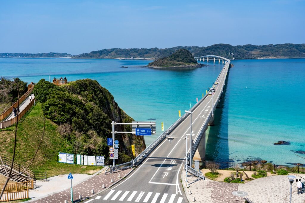 Bridge spanning over emerald green waters