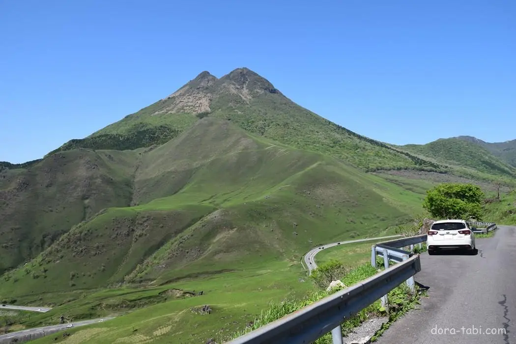 ush green mountains with a winding road