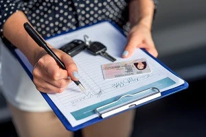 Person completing vehicle paperwork