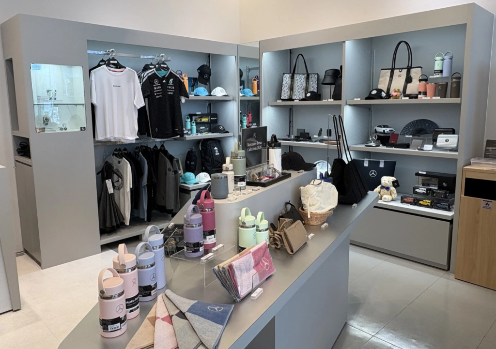 Mercedes-Benz merchandise shop at Tokyo Studio with AMG apparel, bags, and collectibles