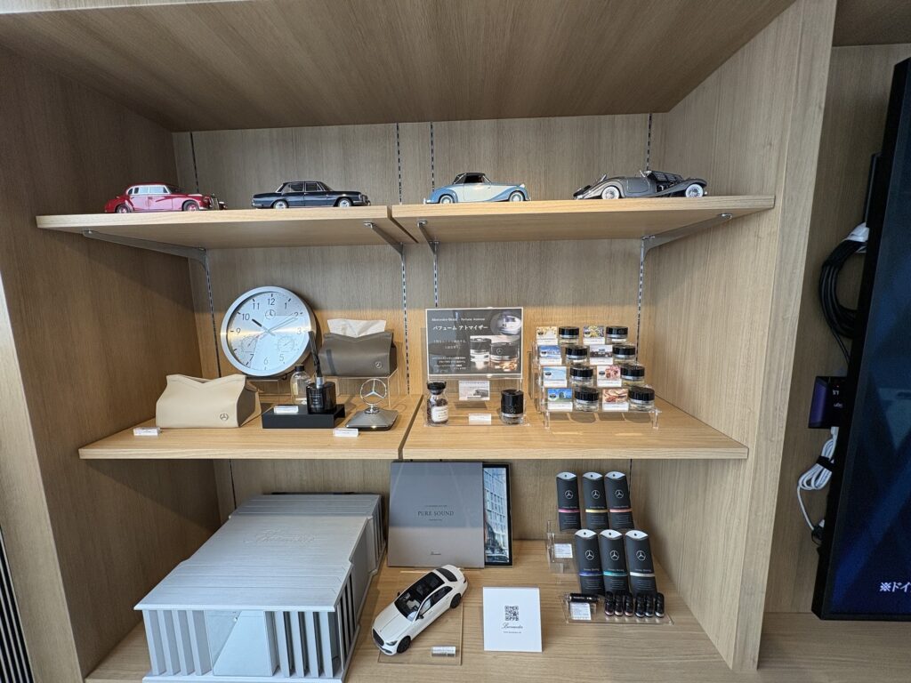 Mercedes-Benz classic car model collection and perfume atomizer display at Tokyo Studio"