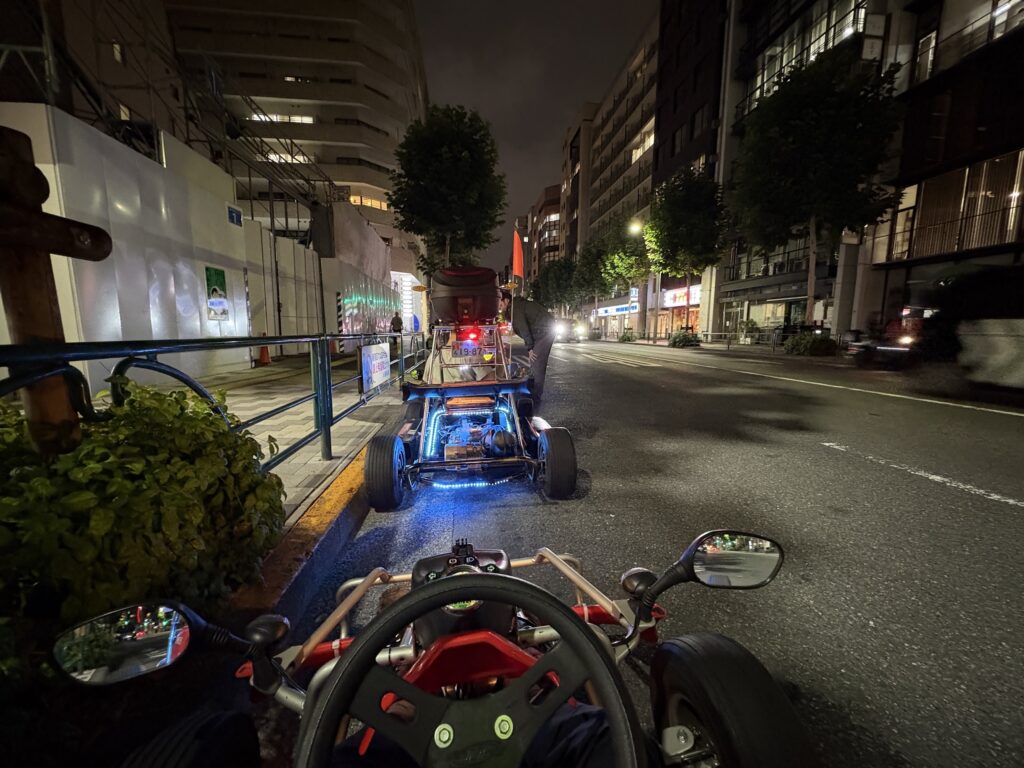 Go kart tour driving through quiet Tokyo backstreets at night