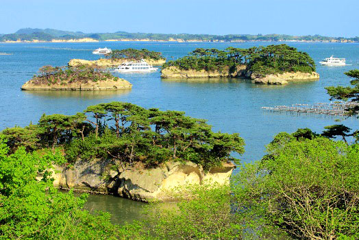 Pine-covered islands and sightseeing boats in Matsushima Bay